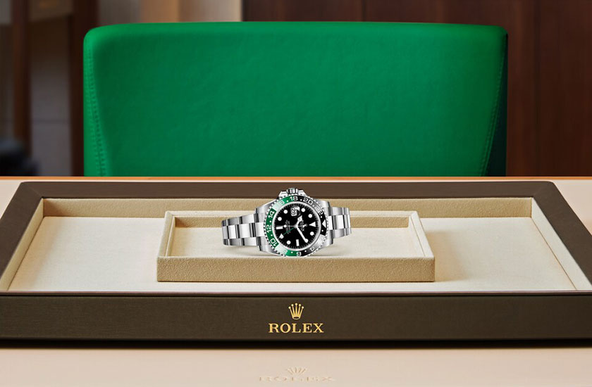  Rolex watch GMT-Master II Oystersteel and Black Dial watchdesk in Grassy
